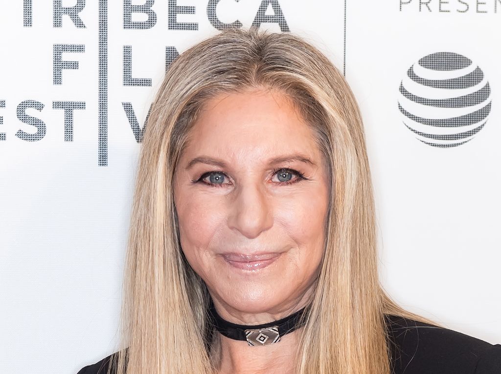 Barbara Streisand in a black suit 